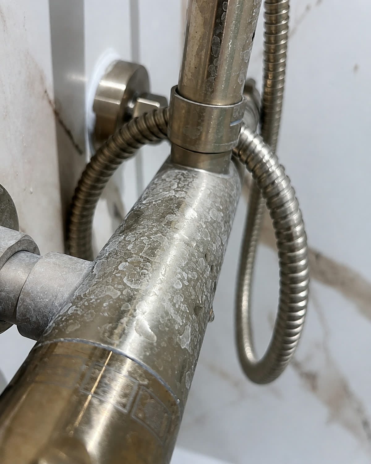 Limescaled shower hose before cleaning